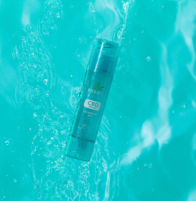 Hempz CBD Balancing Act Hydrating Facial Serum floating in water